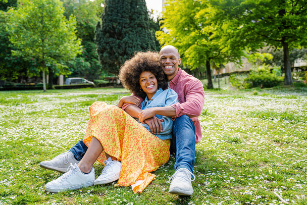 Beautiful happy african american couple dating at the park - Фото, зображення