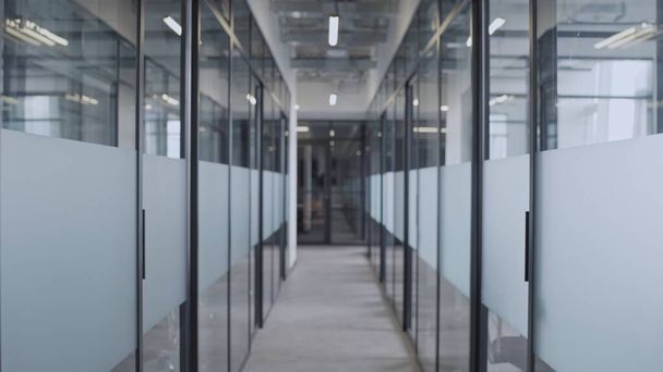 Empty hall of business office with glass doors, working place of big corporation - 写真・画像