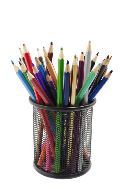 various colored pencils standing in grilled pencil cup isolated  - Photo, Image