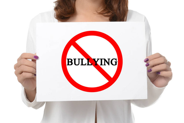 woman showing and holding billboard say no bully  isolated on white background - Photo, image