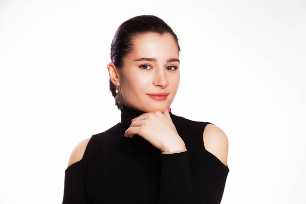 Woman with short hair and clean skin. Face close up, skin beauty tanned, beautiful smile woman in black turtleneck over white background - Photo, Image