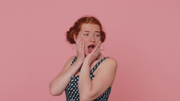 Scared fearful redhead woman covering ears with hands, closing eyes, meeting her own phobia, evidence horror event, screaming, shouting at loud, freaked out. Girl with freckles on pink background - Footage, Video
