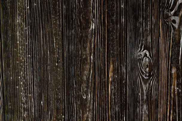 Old wood texture background. Dark brown wooden boards, planks. Surface of dark shabby weathered parquet, desk - Photo, image