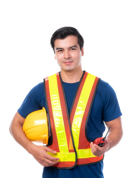 Portrait young architect man engineering holding yellow helmet and megaphone in hand , He standing arms crossed isolated on white background with copy space - 写真・画像