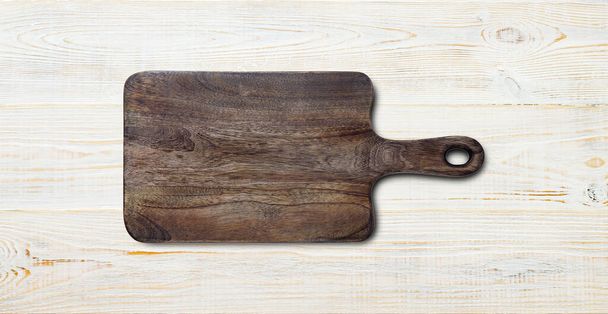 Empty vintage cutting board on planks food background concept - Фото, зображення