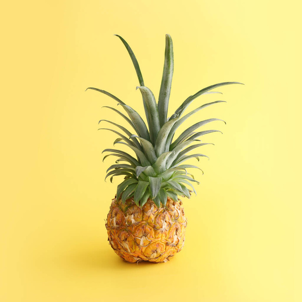 Ripe pineapple over yellow background. Beach and tropical theme - Valokuva, kuva