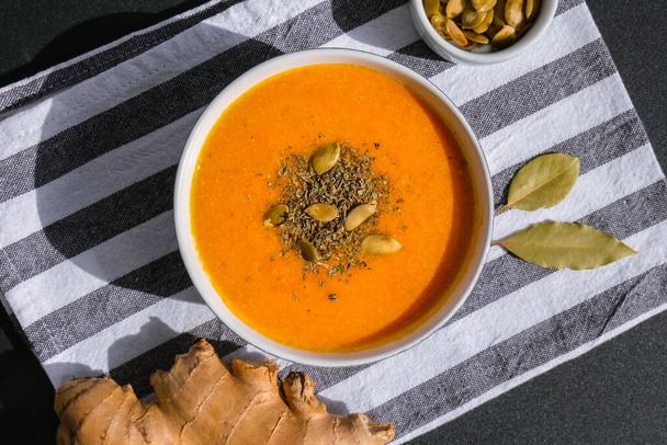Homemade carrot ginger curcuma soup. Seasonal Pumpkin traditional soup with creamy silky texture. Healthy vegan clean eating. Seasonal spicy fall vegetables creamy pumpkin and carrot soup Prevention of antiviral infections - Фото, изображение
