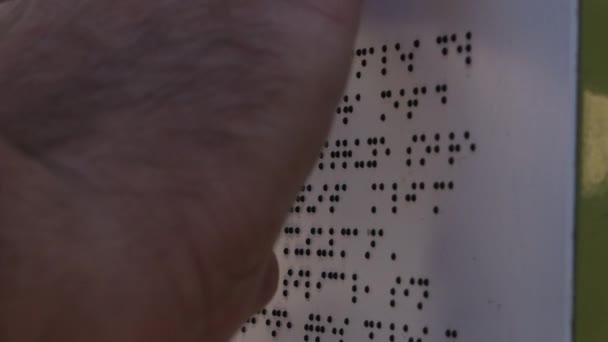 Reading a braille text in a sign outdoor - Materiał filmowy, wideo