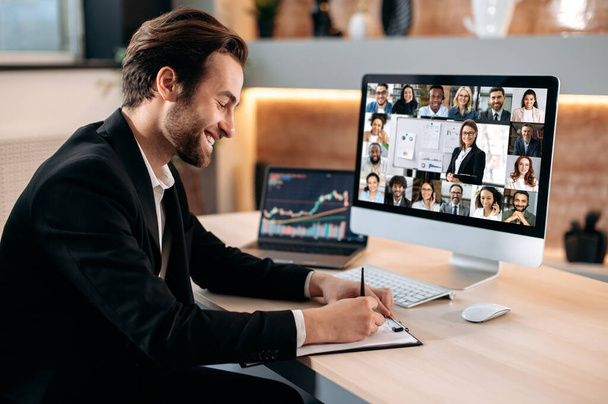 Remote business briefing, brainstorming. Positive caucasian male manager, ceo, participates in a video conference with group of multiracial colleagues discussing the financial strategy of new project - Foto, immagini
