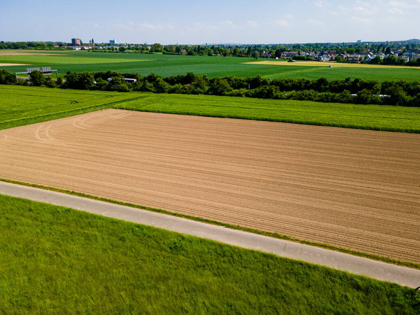 Farmland from above. Aerial view over green fields - Φωτογραφία, εικόνα