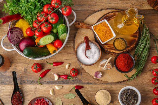 Composition with different spices and products on wooden background - Foto, Imagen