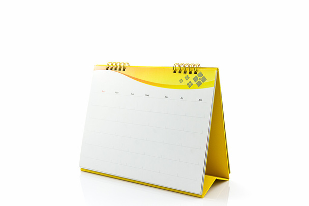 Keltainen tyhjä paperi kirjoituspöytä kierre kalenteri
. - Valokuva, kuva
