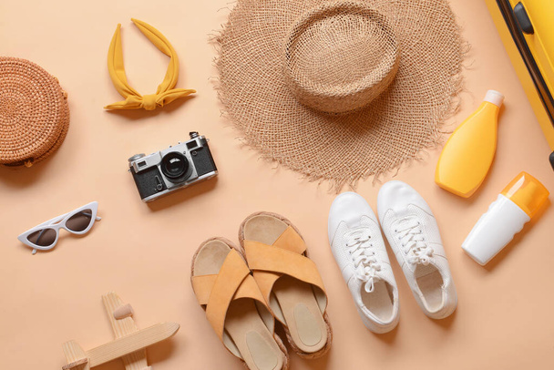 Different accessories for travelling on beige background - Photo, Image