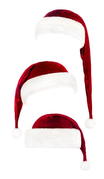 Набор красных шляп Санта-Клауса изолированы на белом
 - Фото, изображение