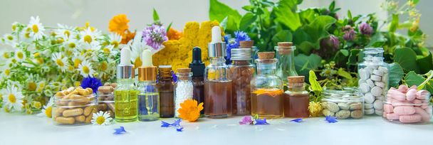 Tinctures, extracts, oils and dietary supplements from medicinal herbs. Selective focus. Nature. - Photo, Image