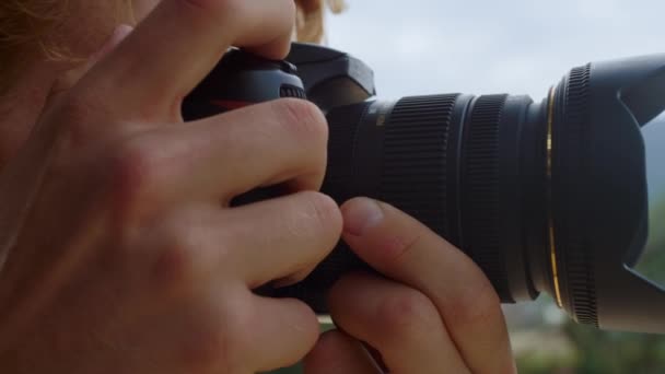 Closeup camera photographer take photo filming nature. Blogger hands make picture outside. Unknown young guy shooting professional digital device on holiday travel. Leisure hobby artistic concept. - Metraje, vídeo