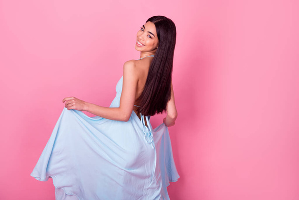 Photo of pretty chic lady stand turned graceful dance disco hold satin skirt isolated pastel color background. - 写真・画像