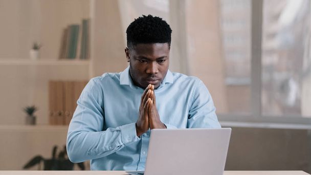 Frustrated shocked african businessman american adult man student work on computer make error mistake feels stress upset with bad news failure e-commerce exam lost internet connection lose online bet - Fotó, kép