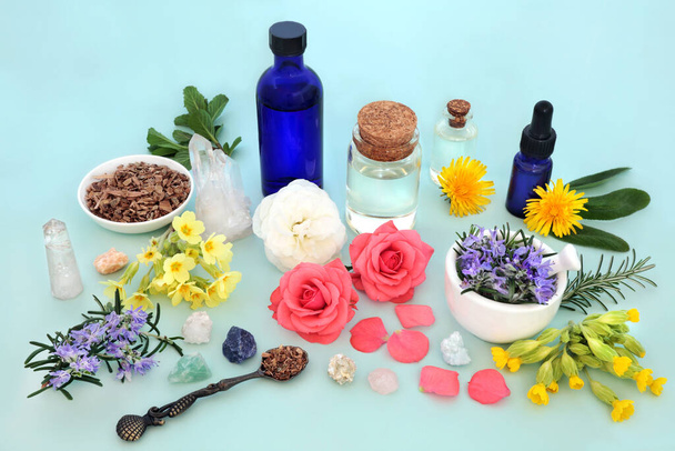 Herb, flower and wildflower ingredients for alternative medicine treatments. Natural pagan traditional health care remedy with essential oils, crystals. Esoteric alchemy wicca concept. On blue. - Zdjęcie, obraz