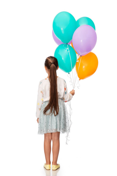 birthday, childhood and people concept - portrait of smiling little girl party hat with balloons over white background - Фото, зображення