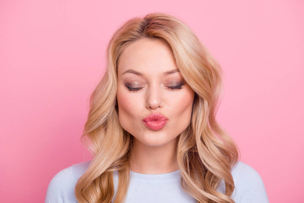 Photo of stunning cute lady closed eyes pouted lips kiss isolated on pastel pink color background. - Zdjęcie, obraz