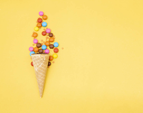 crispy candy over on yellow background - Foto, imagen