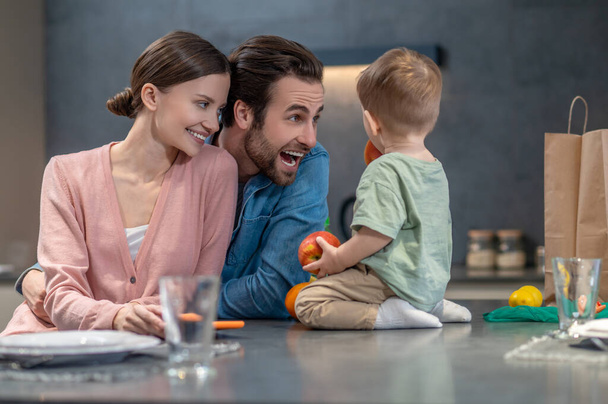 Healthy eating. Young happy family preparing to have a healthy lunch - Fotoğraf, Görsel