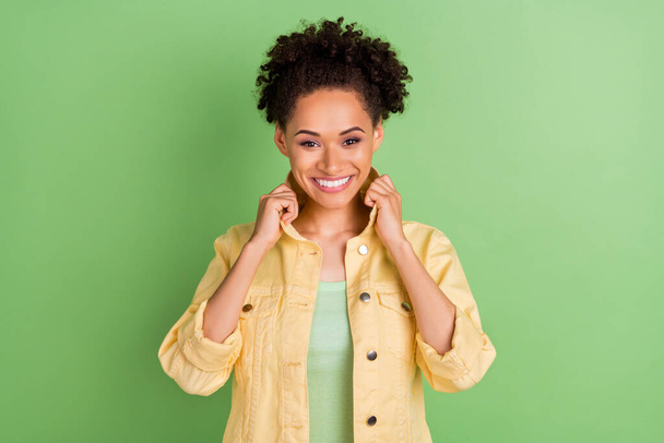 Photo of sweet young brunette lady wear yellow shirt isolated on green color background. - Φωτογραφία, εικόνα
