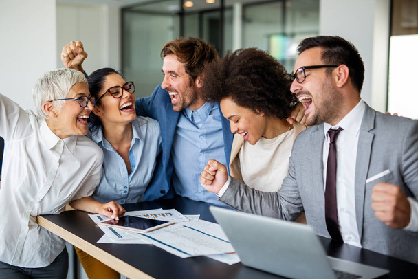Happy group of multiethnic business team celebrating a good job in the office. Business and finance concept. - Fotoğraf, Görsel