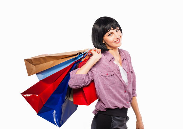 young brunette woman with shopping bags - Фото, зображення