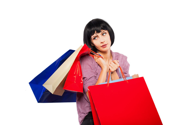 young brunette woman with shopping bags - 写真・画像