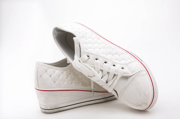 Pair of new white sneakers on white background - Zdjęcie, obraz