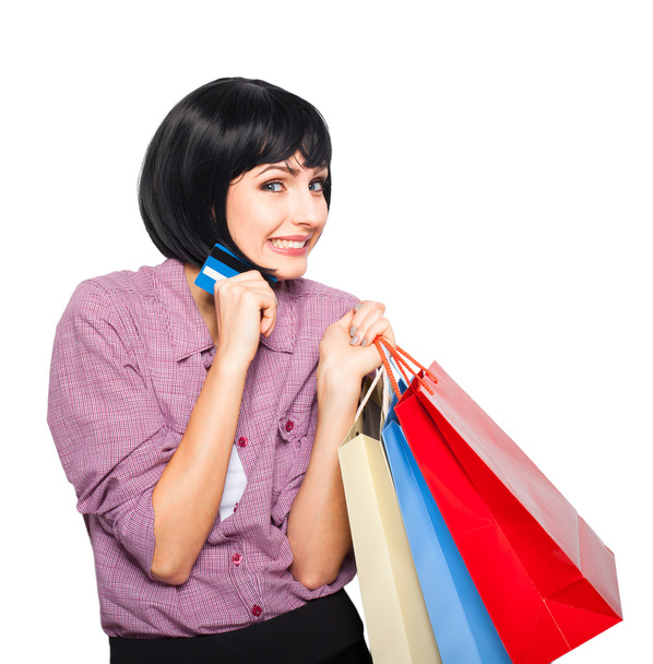 young beautiful woman with credit card and shopping bags - Foto, imagen