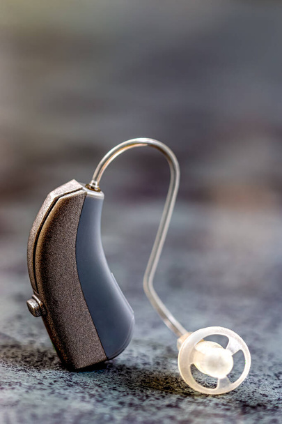 Macro headset on a gray background - Fotó, kép