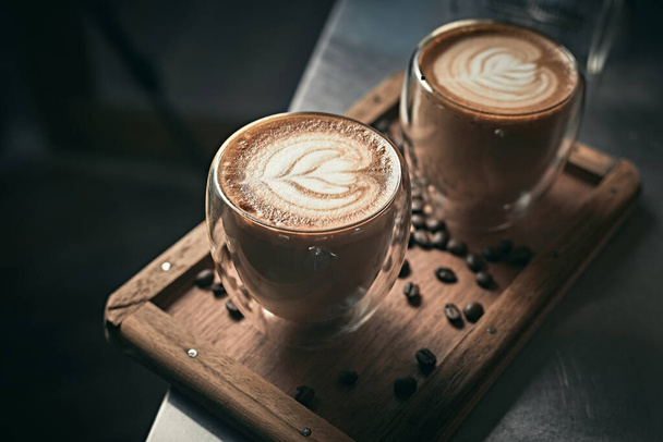 Selective focus cup of hot latte art coffee,focus at white foa - Φωτογραφία, εικόνα