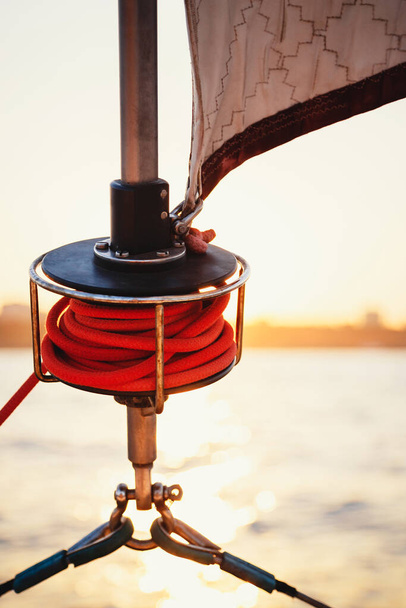 Sailboat winch, sail and nautical rope yacht detail. Yachting, marine background. - Фото, зображення