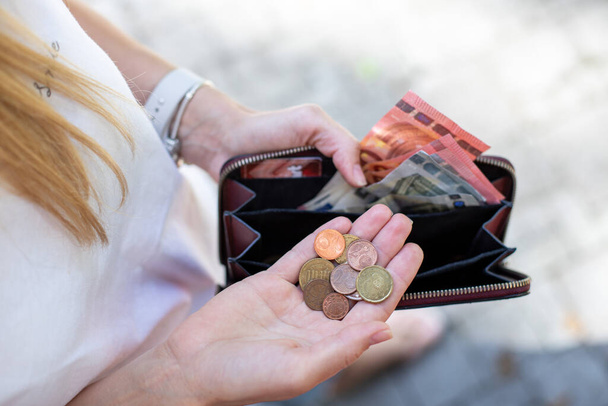 person holding a wallet with money,  women counting  coins - Photo, Image