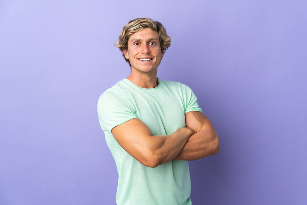 English man over isolated purple background with arms crossed and looking forward - 写真・画像