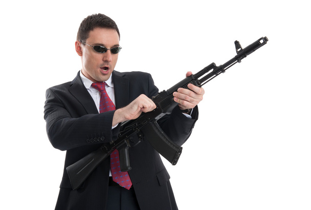 bodyguard with automatic rifle - 写真・画像