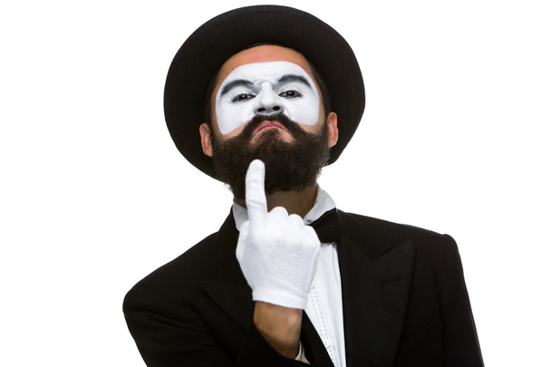 Portrait of mime with pointing finger - 写真・画像