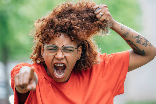 african american girl pointing screaming furious - Photo, Image