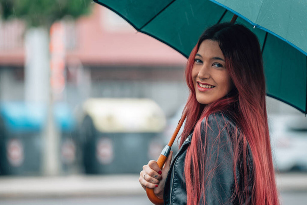 girl on the street with umbrella - Fotoğraf, Görsel