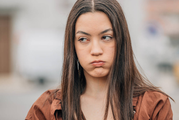 girl with expression of anger or fury outdoors - Foto, Imagem