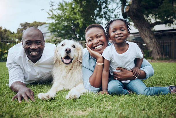Shot of a having a family having fun at home with their dog. - 写真・画像