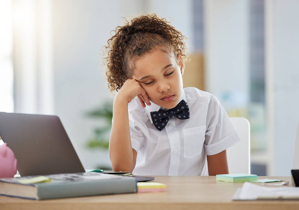 Shot of an adorable little girl dressed as a businessperson sitting alone in an office and feeling sleepy. - Photo, Image