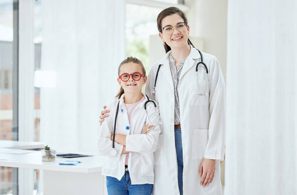 Shot of a little girl standing with a doctor at a hospital. - Photo, Image