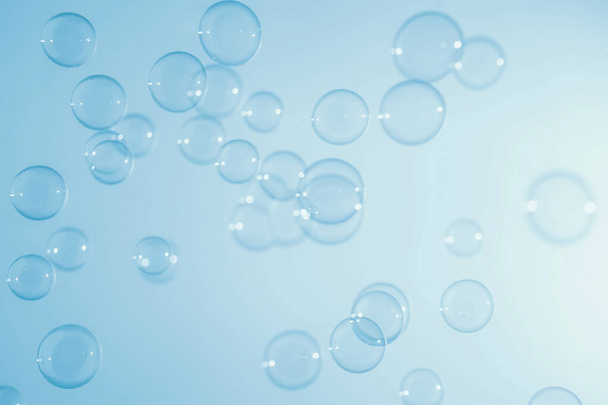 Abstract Beautiful Transparent Blue Soap Bubbles Background. Soap Sud Bubbles Water - Foto, immagini