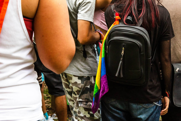 teen girl with backpack and lgbt flag in pride, urban lifestyle fashion - Foto, immagini