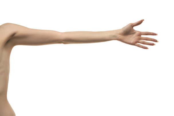 Nataženou ruku a dlaň mladé ženy. Izolováno na bílém pozadí. - Fotografie, Obrázek