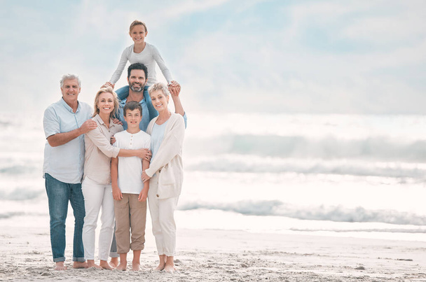 Shot of a beautiful family bonding while spending a day at the beach together. - Foto, immagini
